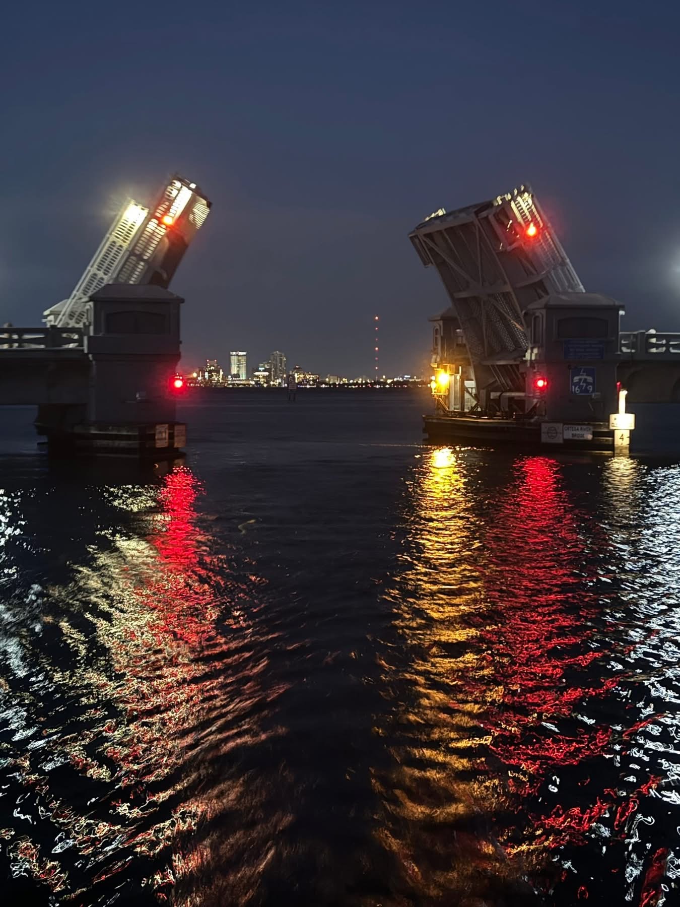 Jacksonville drawbridge opening at night viewed from Now and Zen catamaran on the St Johns River