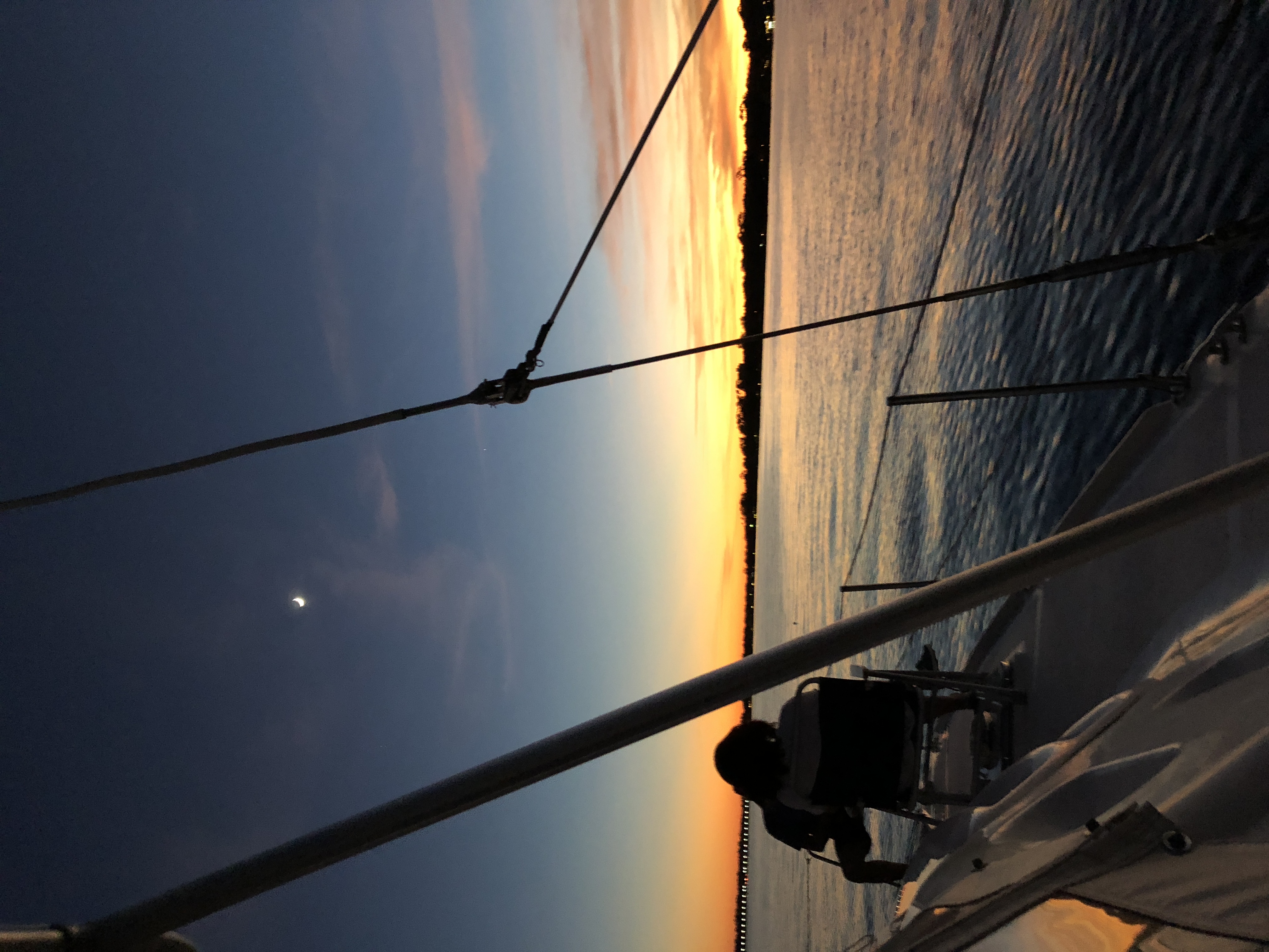 Stunning sunset view from the bow of Now and Zen sailing catamaran on the St Johns River