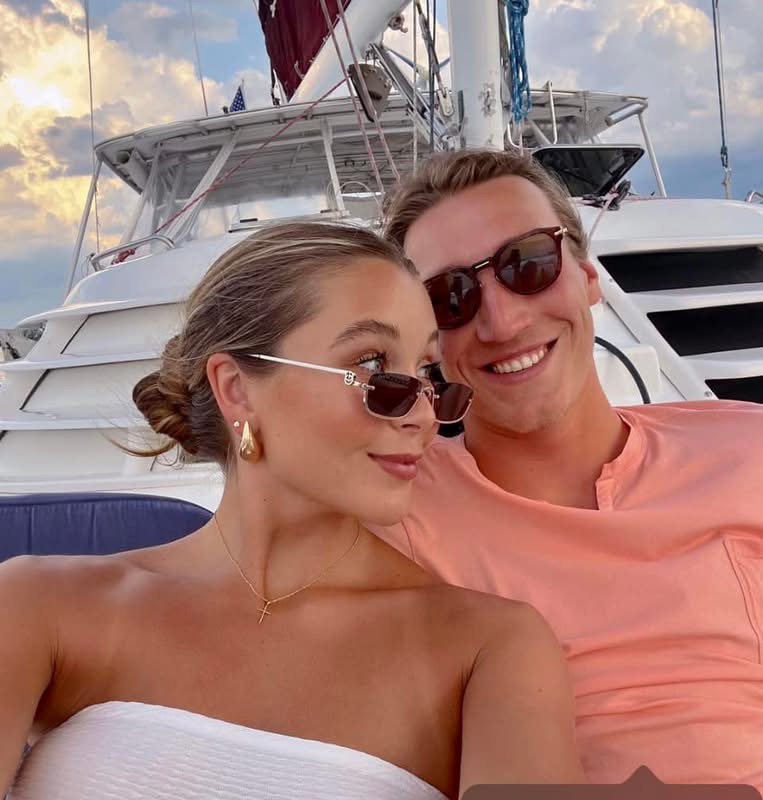 Happy couple enjoying a sunset sail on Now and Zen catamaran Jacksonville