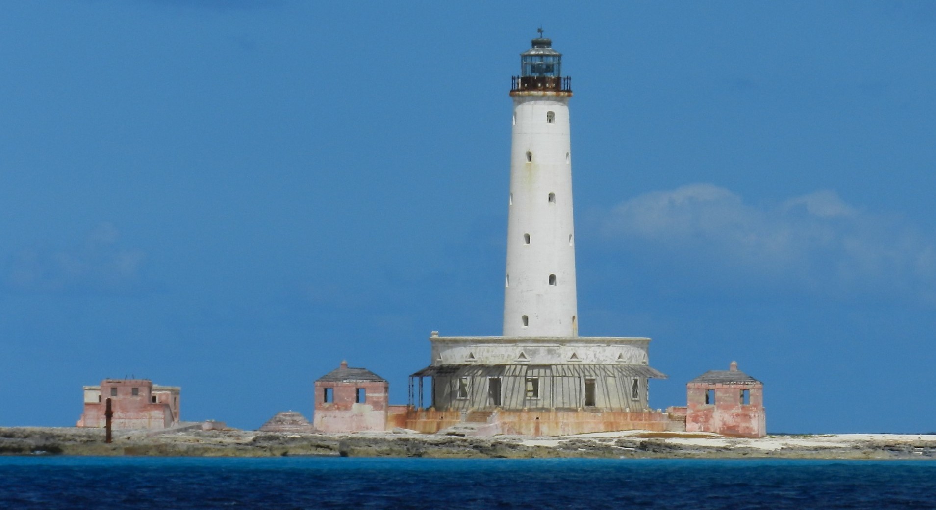 Historic Crooked Island lighthouse rising above the turquoise waters of Acklins Bahamas